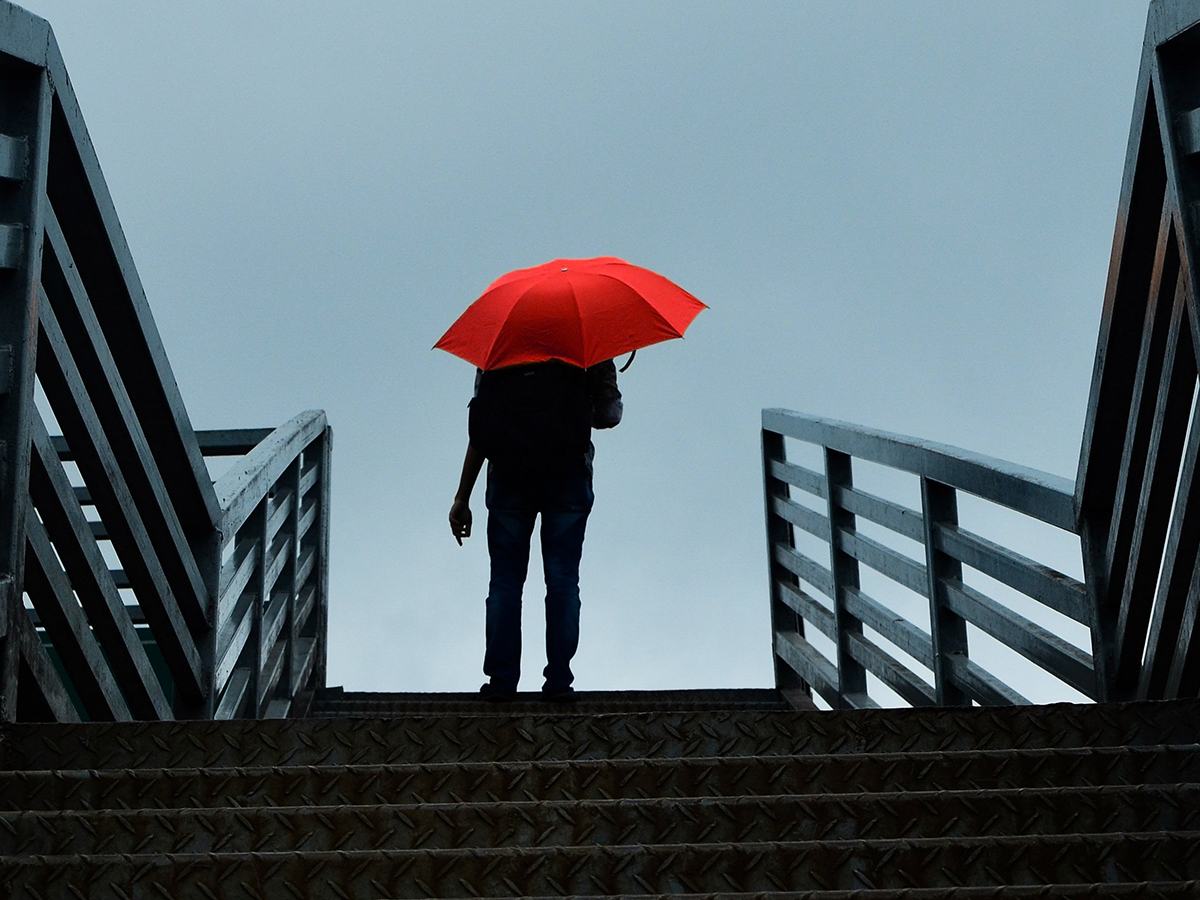 picture of a person holding red umbrella